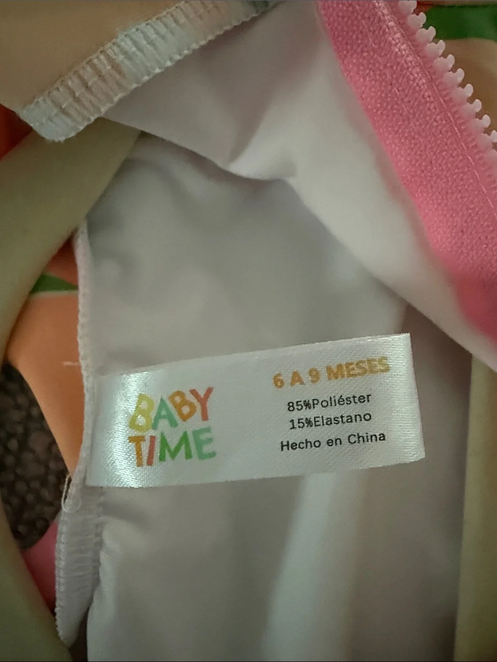 Girls Long-Sleeve One-Piece Bodysuit in Pink, Peach & Green Floral